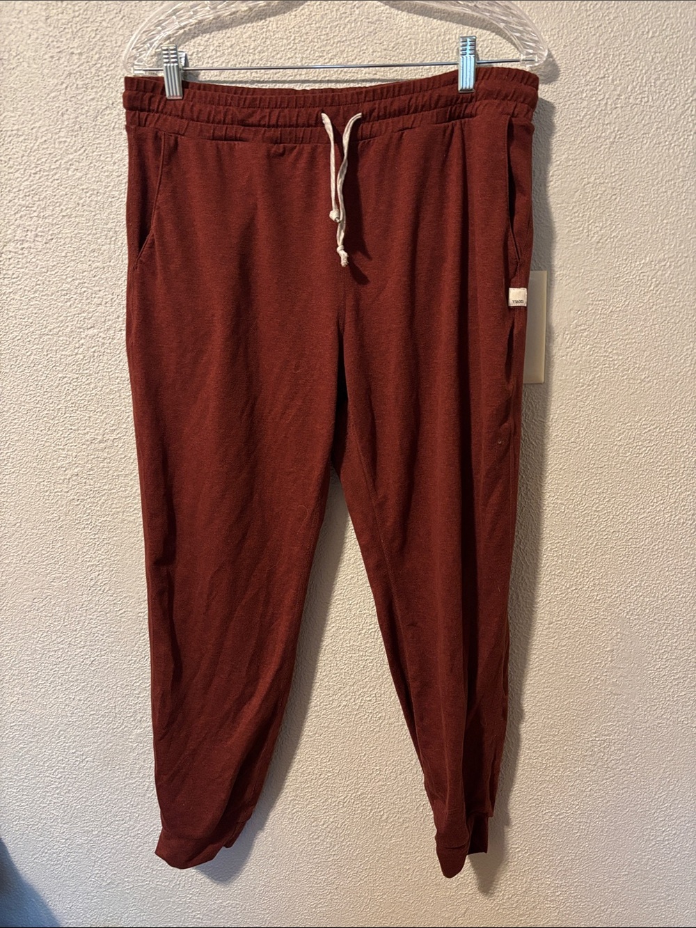Vuori sweatpants in a brick red